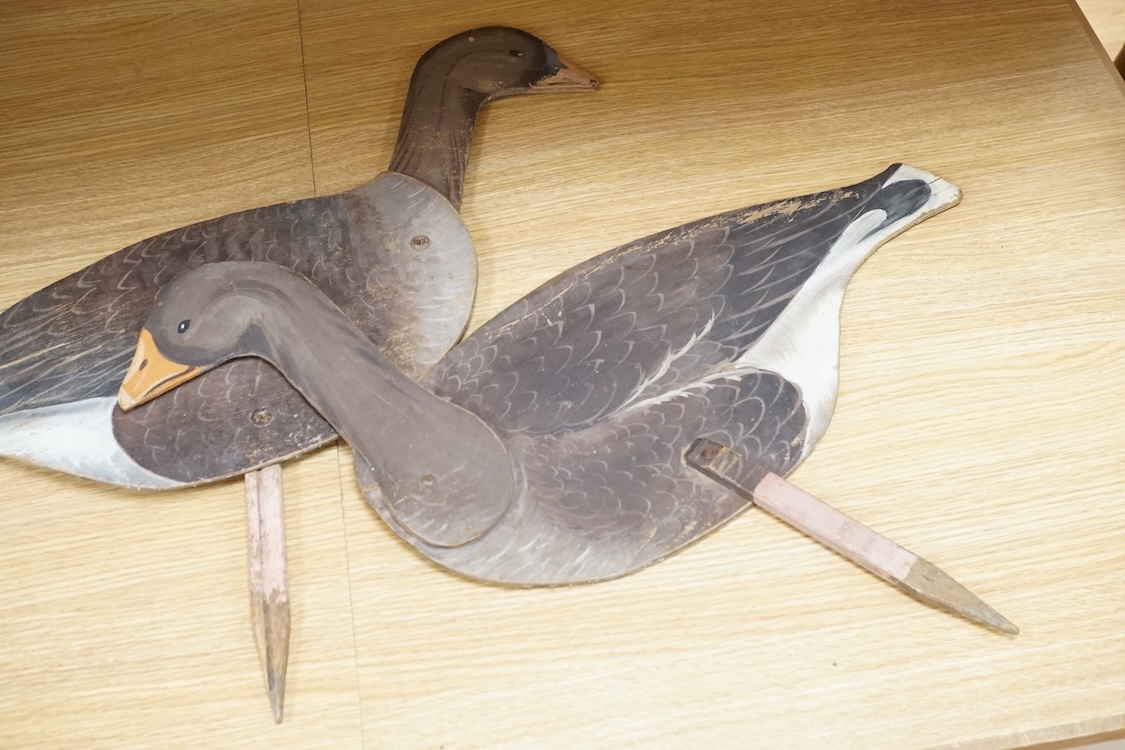 A pair of painted ply 'goose' profile decoys, 58cm high